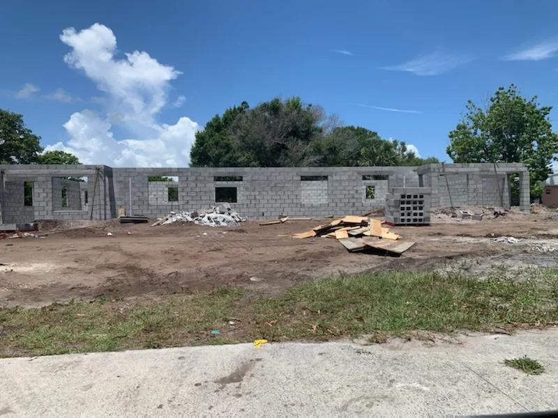 Concrete block construction underway on a new DND Construction home